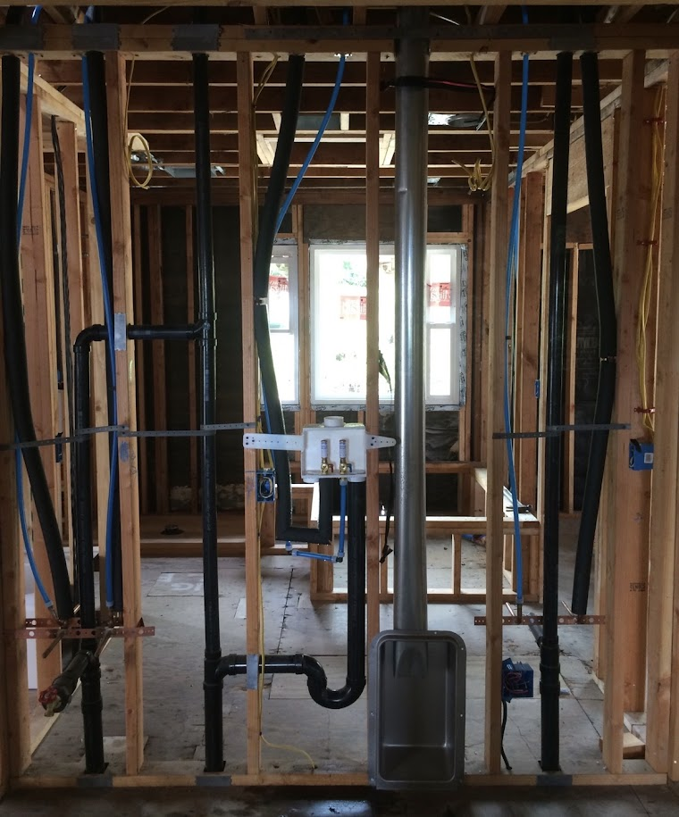 New construction rough-in plumbing for washing machine and wash basin