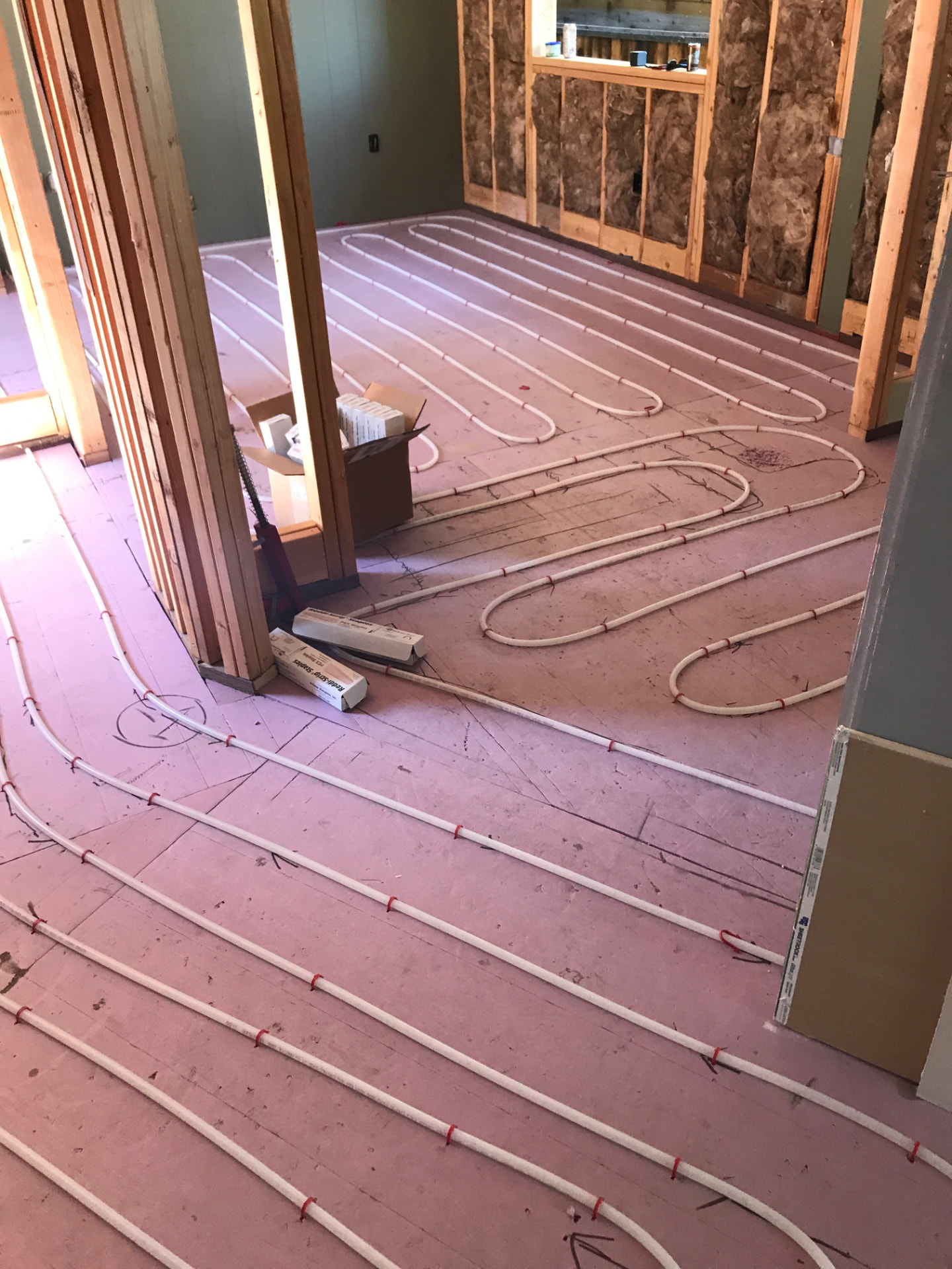 Radiant floor hydronic heating and cooling tubing installation in new construction